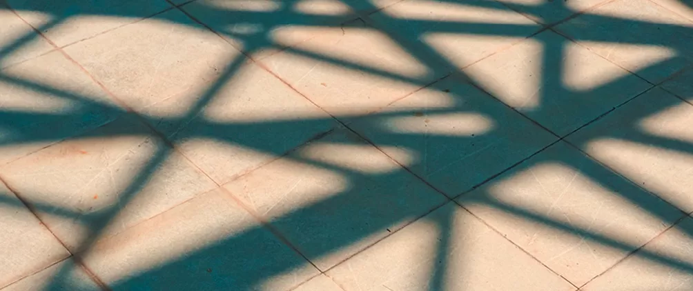 Abstract shadows on pavement representing SLC Management’s Q1 2026 investment grade private credit market update.