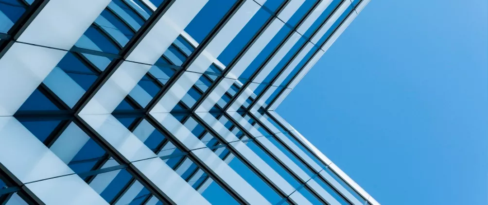 Modern glass building facade representing Northleaf Capital Partners’ outlook on private equity secondaries, liquidity and portfolio construction in 2026.